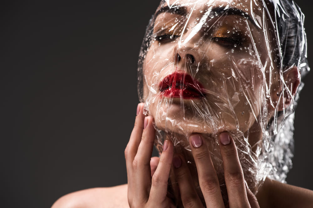Face wrapped in plastic